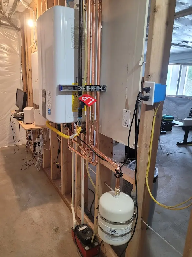 Licensed plumber repairing a kitchen sink in Hamilton